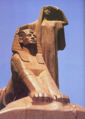 Egypt's Renaissance- a sculpture of a sphinx and a woman taking off her veil, the goddess Isis perhaps.